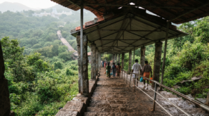Alipiri footpath timings guide with covered steps and pilgrims climbing toward Tirumala