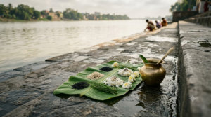 Maha Bharani Shraddha 2026 tarpanam offering with water and black sesame at a riverside ghat