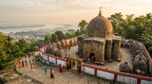 Temples in Assam: Kamakhya Devalaya temple complex on Nilachal Hill, Guwahati, with pilgrims on the approach steps