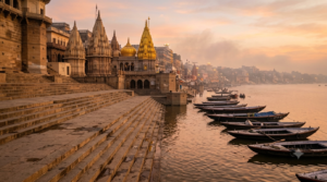 Temples in Uttar Pradesh: Varanasi Ganga ghats and temple spires at dawn with distant pilgrims