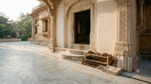 Jain temple etiquette illustrated by a quiet marble temple entrance and footwear area